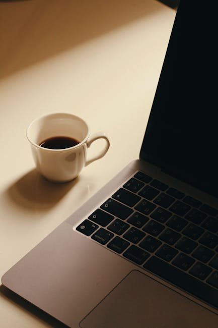 A cheerful blogger in a home office, seated comfortably sipping coffee while brainstorming ideas with ChatGPT visible on the laptop screen