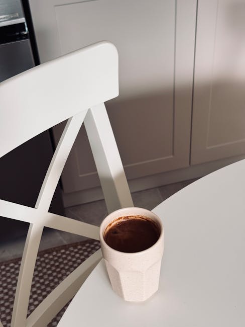 A cozy kitchen where an automatic coffee maker is brewing in sync with a smart home schedule